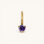 Nadare Co. mini gold hoop charm featuring a round-cut purple amethyst birthstone in a three-prong setting.
