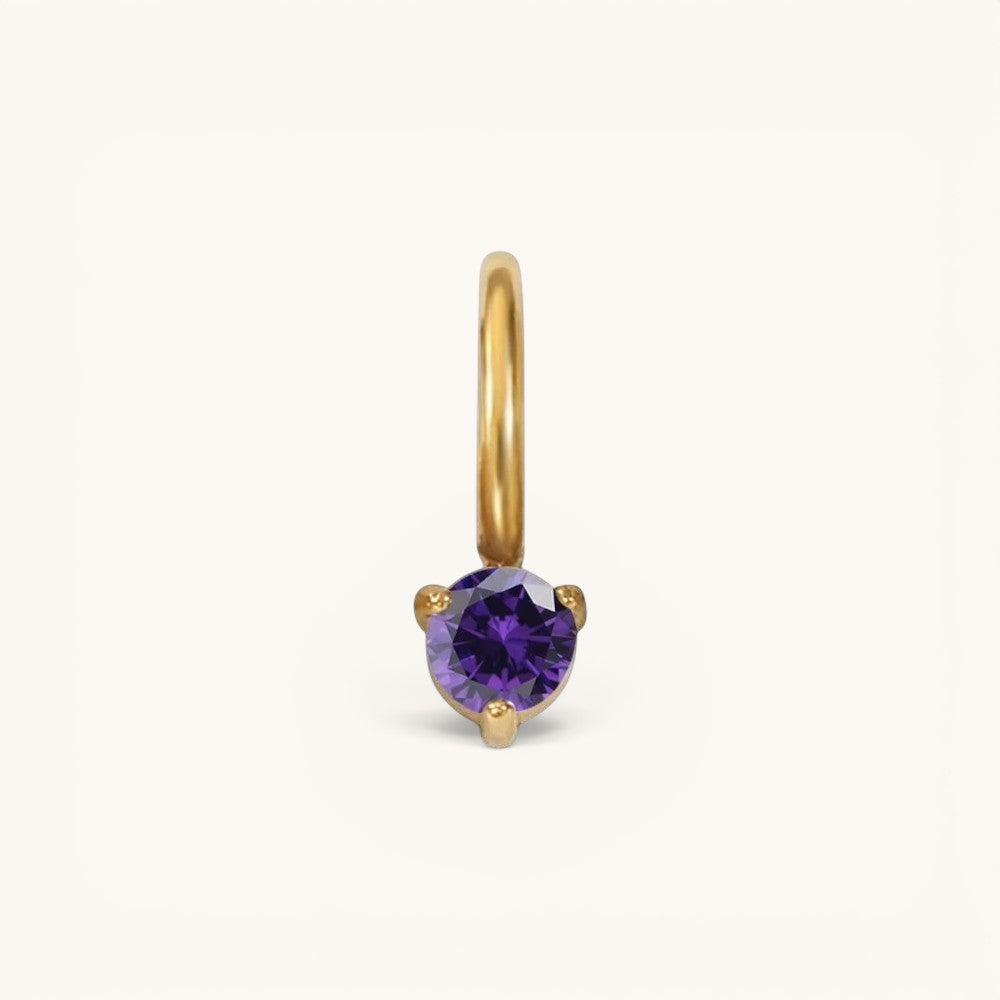 Nadare Co. mini gold hoop charm featuring a round-cut purple amethyst birthstone in a three-prong setting.