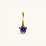 Nadare Co. mini gold hoop charm featuring a round-cut purple amethyst birthstone in a three-prong setting.