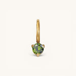 Nadare Co. mini gold birthstone charm featuring a round-cut green gemstone in a delicate prong setting.