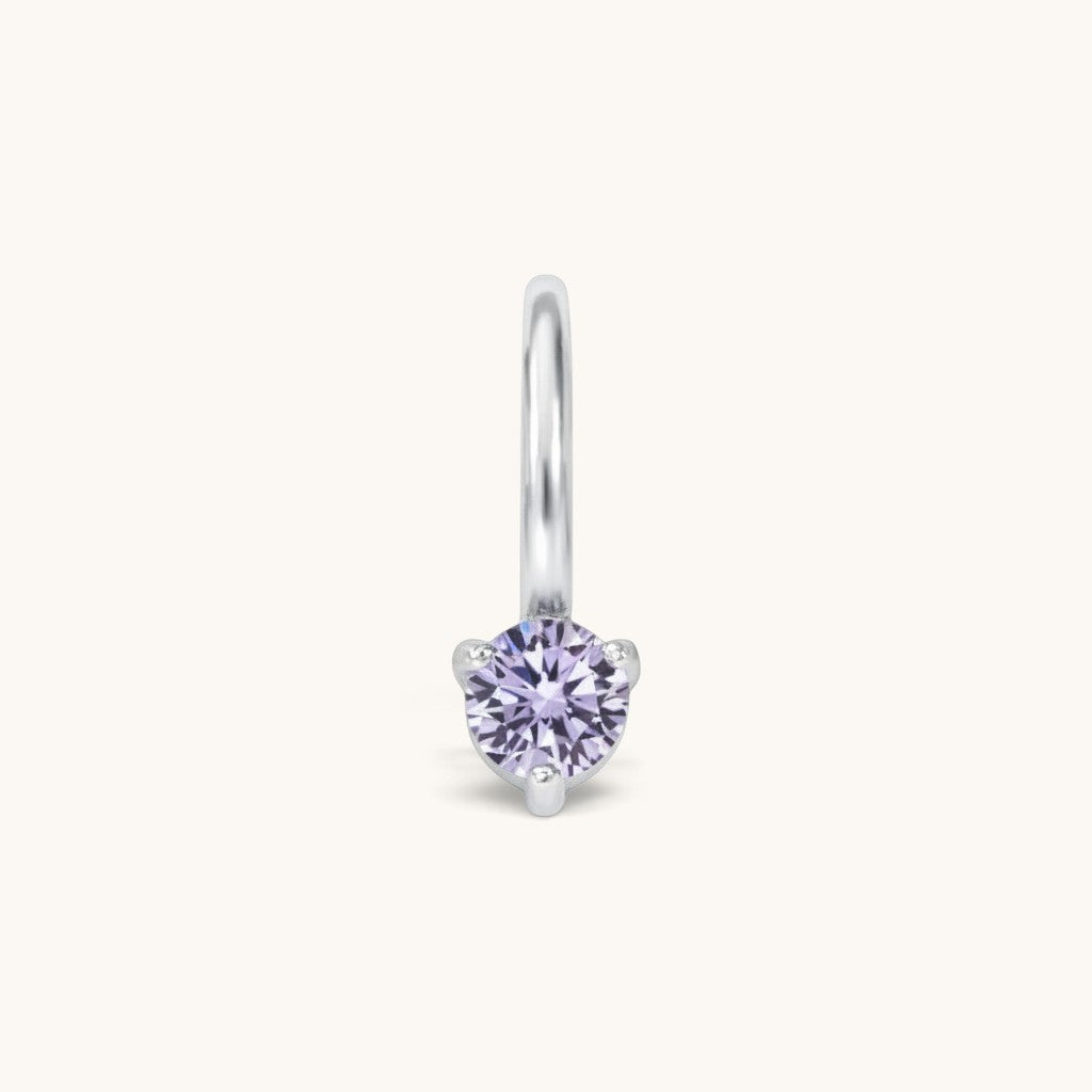 Nadare Co. mini birthstone charm in silver-tone stainless steel with a sparkling light purple cubic zirconia stone.