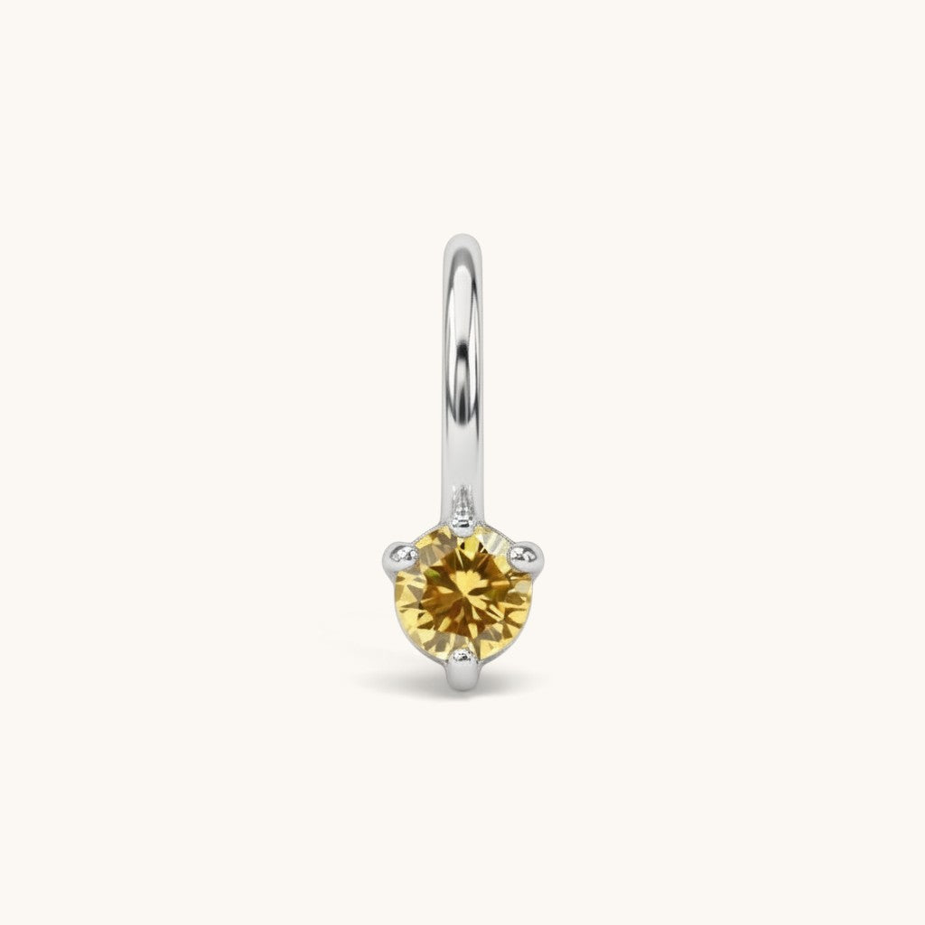 Nadare Co. mini birthstone charm featuring a round yellow cubic zirconia stone set in silver-tone stainless steel.