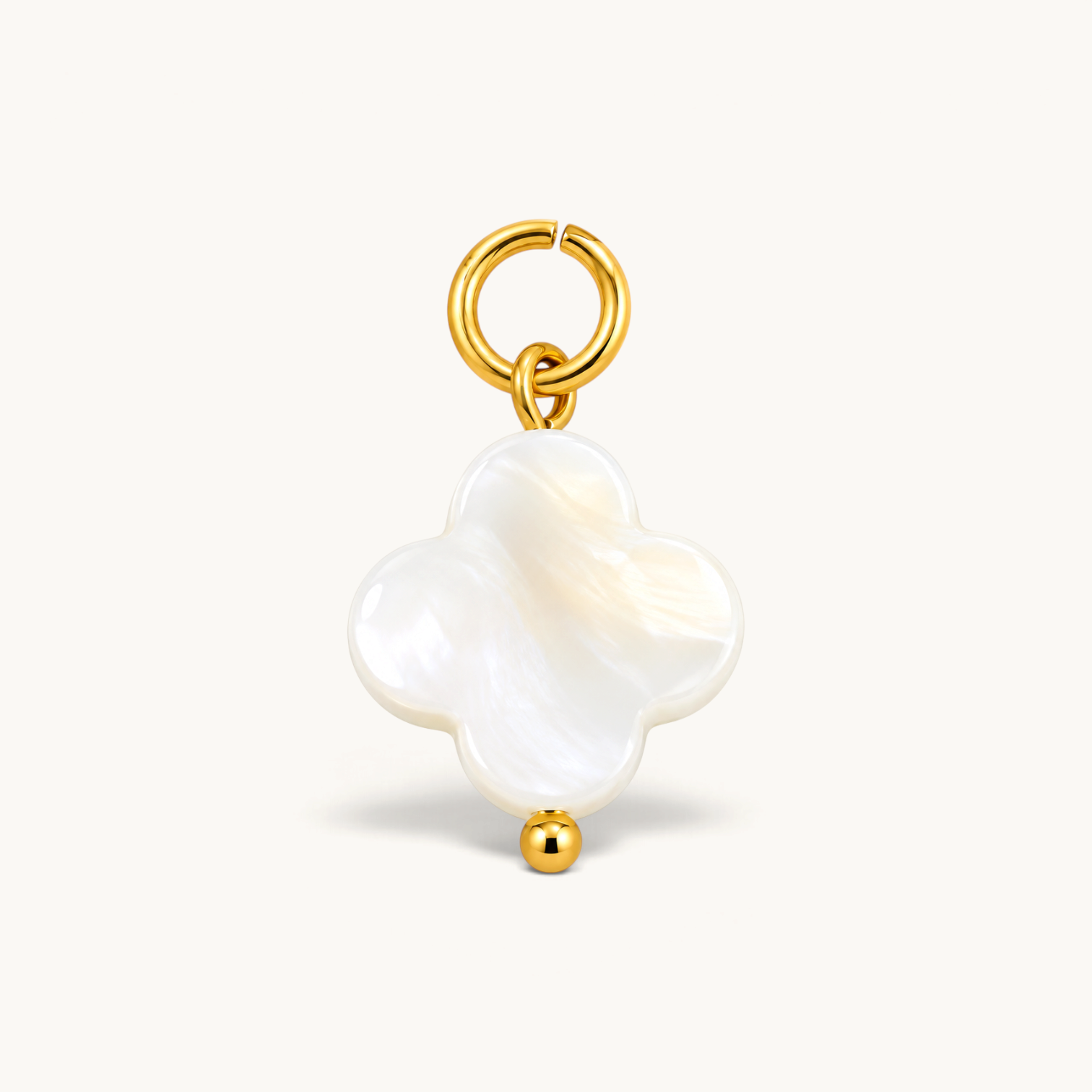 Nadare Co. clover charm featuring white mother of pearl inlay with 14k gold plated stainless steel hardware.