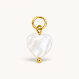 Nadare Co. Mother of Pearl heart charm with 14k gold plated stainless steel hardware and a small gold bead accent.