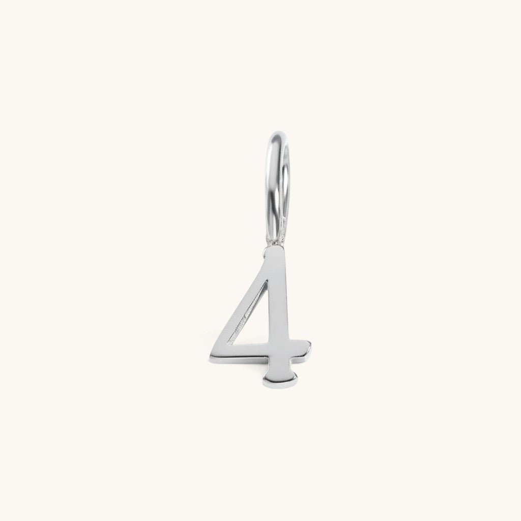 Nadare Co. number four charm in silver-toned stainless steel, perfect for personalized everyday jewelry layering.