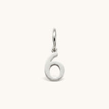 Nadare Co. silver-toned number six charm made from stainless steel for minimal everyday jewelry layering.