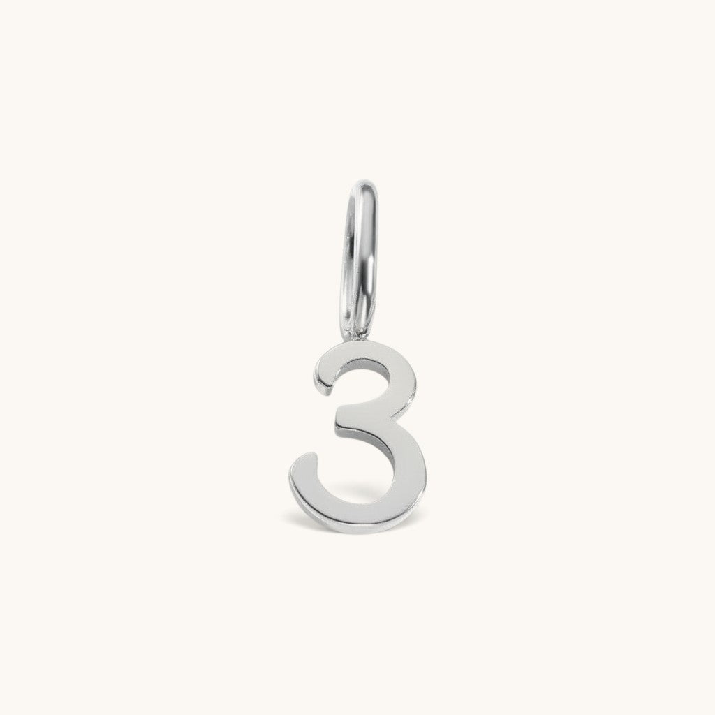 Nadare Co. number three charm in polished silver-tone stainless steel for minimalist jewelry layering