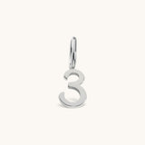 Nadare Co. number three charm in polished silver-tone stainless steel for minimalist jewelry layering