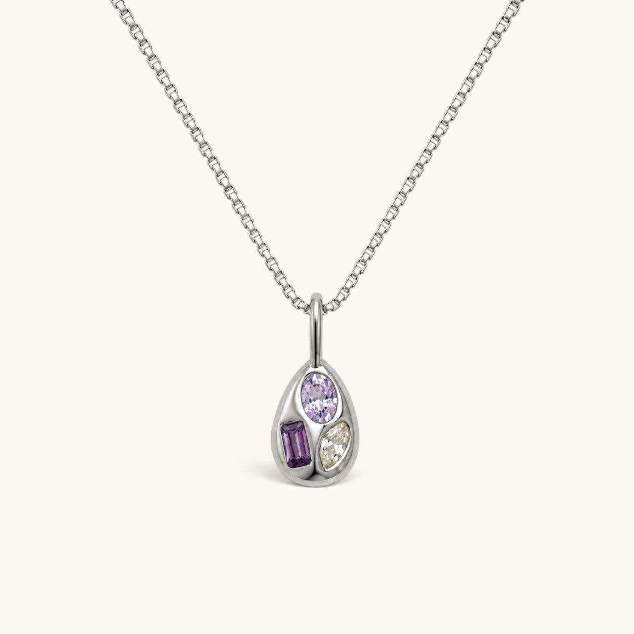 Nadare Co. Paloma Necklace featuring a sculptural silver pendant with three mismatched colourful gemstone accents.
