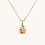 Nadare Co. Paloma Necklace featuring a gold sculptural pendant with three mismatched colorful gemstones on a box chain