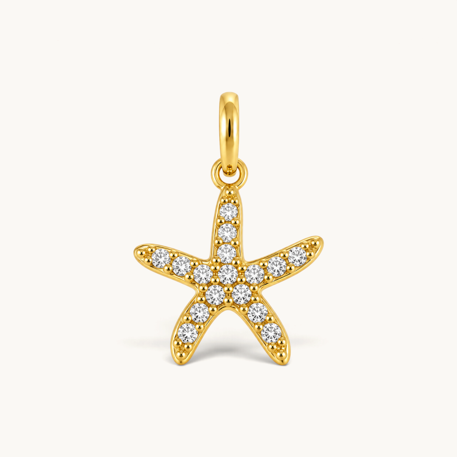 Nadare Co. gold-plated starfish charm featuring sparkling cubic zirconia stones on a stainless steel base.