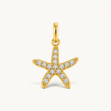 Nadare Co. gold-plated starfish charm featuring sparkling cubic zirconia stones on a stainless steel base.