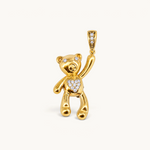 Nadare Co. gold-plated teddy bear charm with cubic zirconia heart, eyes, and pavé bail on a neutral background.