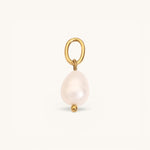 Nadare Co. Pearl Charm featuring a lustrous white baroque pearl suspended from a gold jump ring.