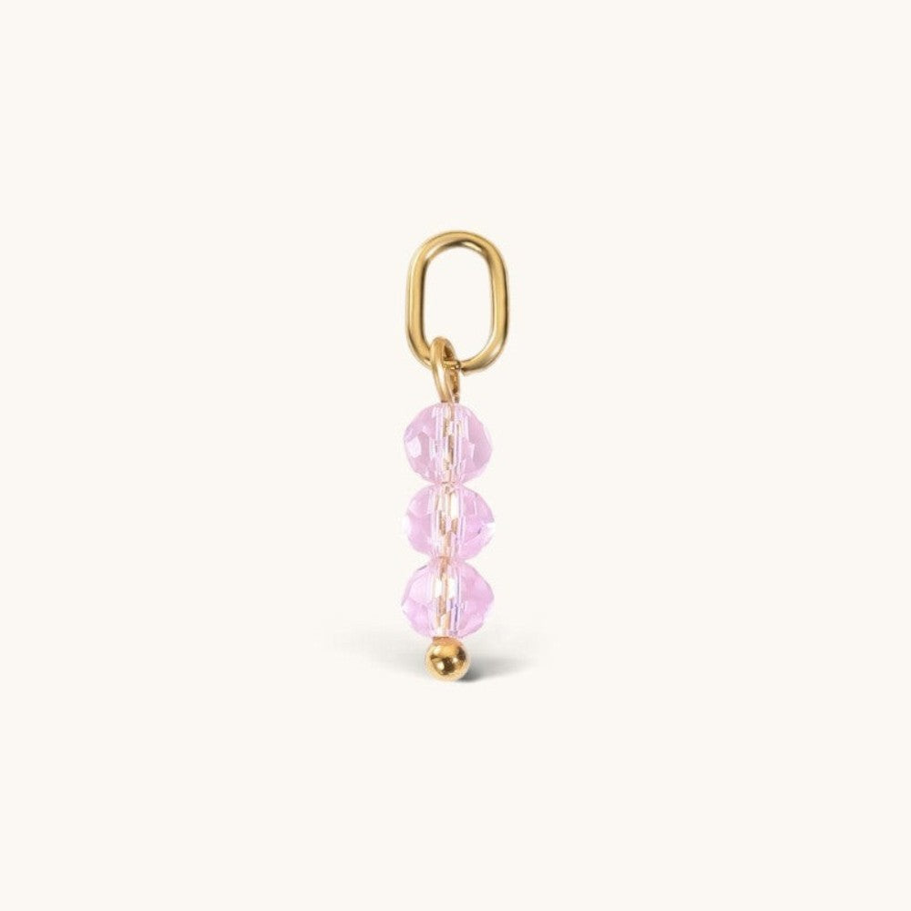 Nadare Co. birth month bead charm featuring three faceted pink crystals and a gold jump ring for necklace stacking.