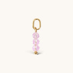 Nadare Co. birth month bead charm featuring three faceted pink crystals and a gold jump ring for necklace stacking.