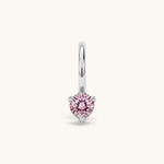 Nadare Co. mini birthstone charm featuring a round pink cubic zirconia stone set in silver-toned stainless steel.