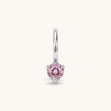 Nadare Co. mini birthstone charm featuring a round pink cubic zirconia stone set in silver-toned stainless steel.