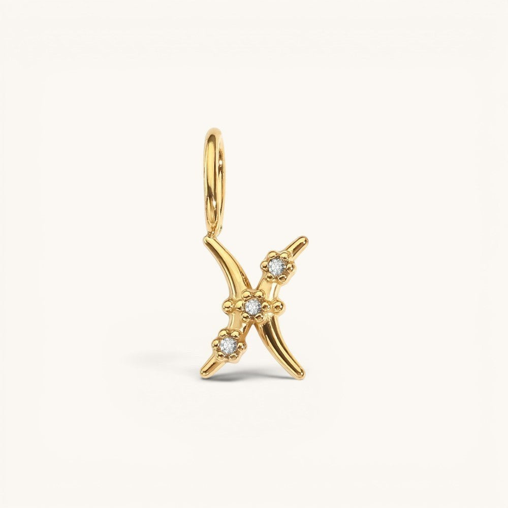 Nadare Co. gold-plated stainless steel Pisces zodiac charm with sparkling cubic zirconia accents for necklace layering.