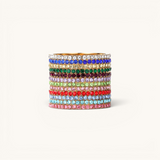 Nadare Co. Prism Birthstone Ring stack featuring multiple gold bands with vibrant colorful crystal gemstones