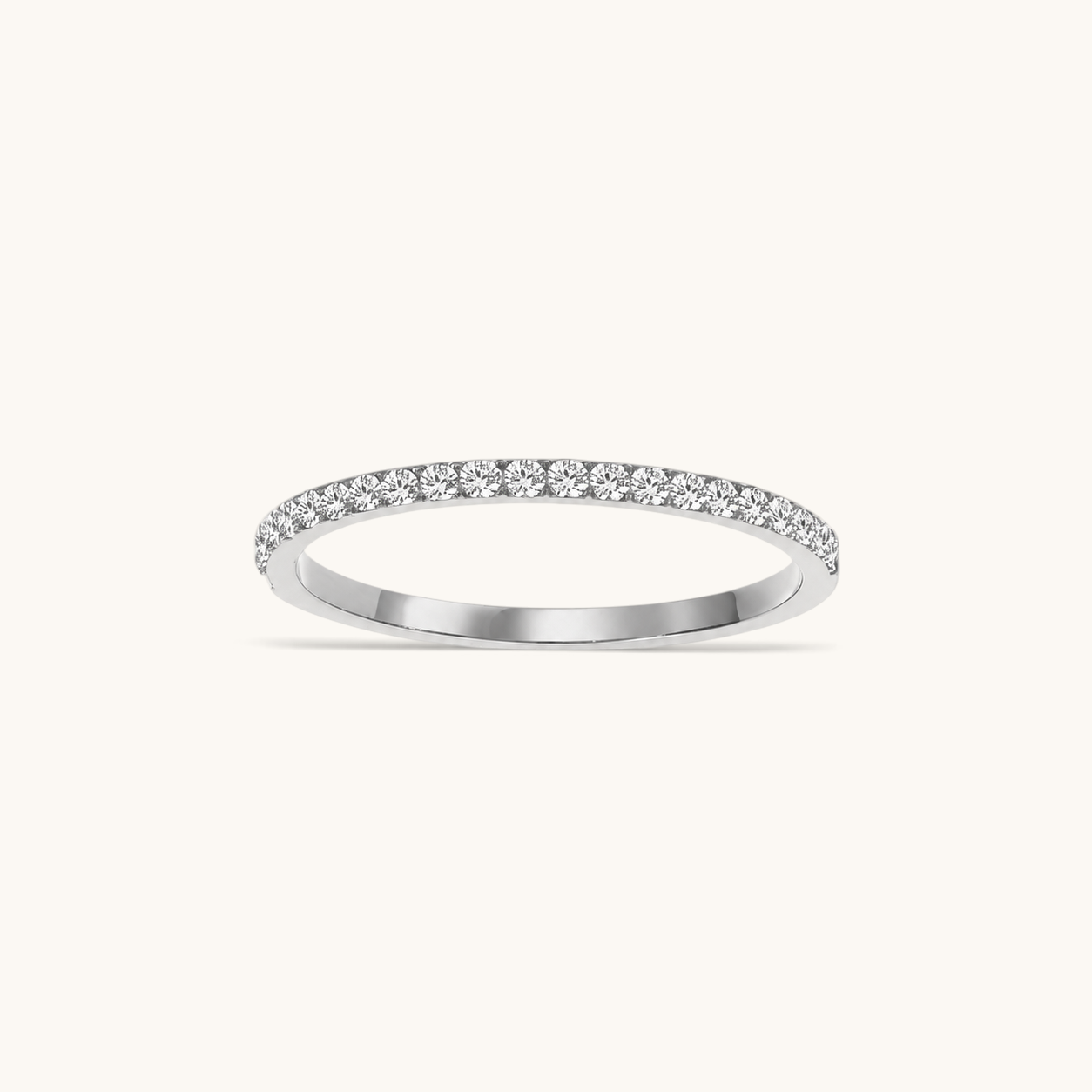 Nadare Co. Prism Birthstone Ring featuring a delicate silver band with a row of sparkling clear stones
