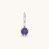 Nadare Co. mini birthstone charm featuring a round purple cubic zirconia stone in a silver-tone setting