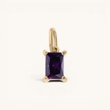 Nadare Co. rectangle birthstone charm featuring a deep purple rectangular gemstone set in polished gold.