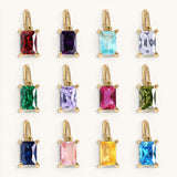 Nadare Co. rectangle birthstone charms in various vibrant colors set in gold, perfect for personalized necklaces.