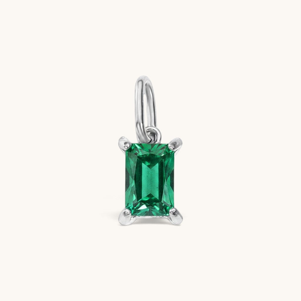 Nadare Co. rectangle birthstone charm featuring a vibrant green emerald-cut cubic zirconia in a silver-tone setting.
