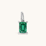 Nadare Co. rectangle birthstone charm featuring a vibrant green emerald-cut cubic zirconia in a silver-tone setting.