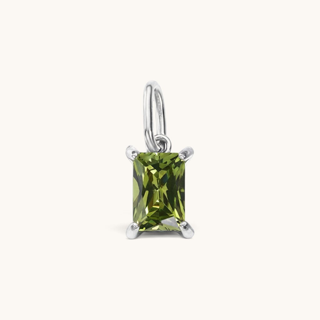 Nadare Co. rectangle birthstone charm featuring a green cubic zirconia stone set in polished silver-tone metal.