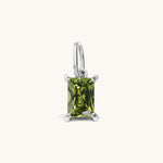 Nadare Co. rectangle birthstone charm featuring a green cubic zirconia stone set in polished silver-tone metal.