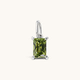 Nadare Co. rectangle birthstone charm featuring a green cubic zirconia stone set in polished silver-tone metal.