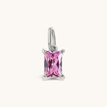 Nadare Co. rectangle birthstone charm featuring a pink cubic zirconia stone set in silver-toned stainless steel.