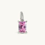Nadare Co. rectangle birthstone charm featuring a pink cubic zirconia stone set in silver-toned stainless steel.