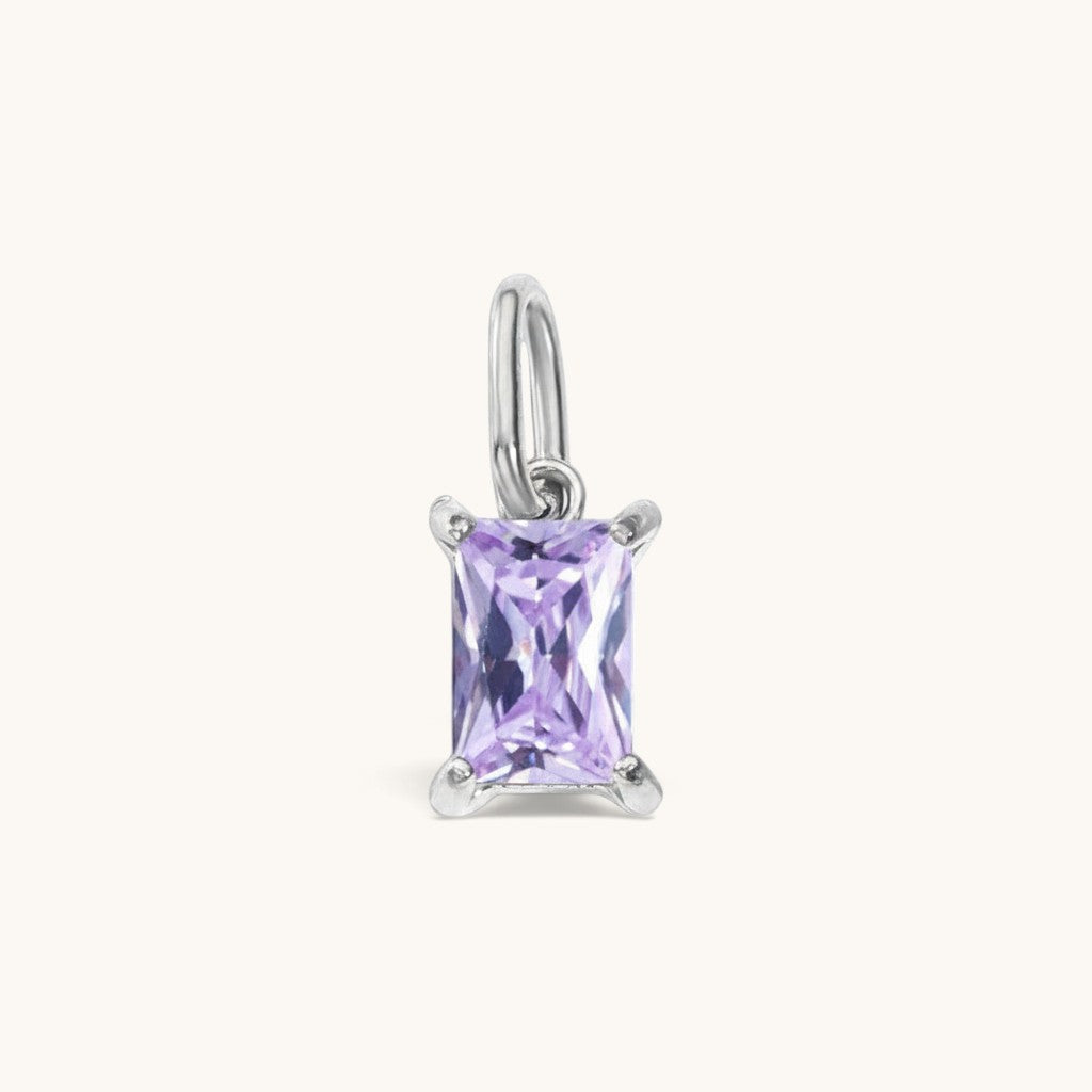 Nadare Co. rectangle birthstone charm featuring a light purple cubic zirconia stone in a silver-tone setting.