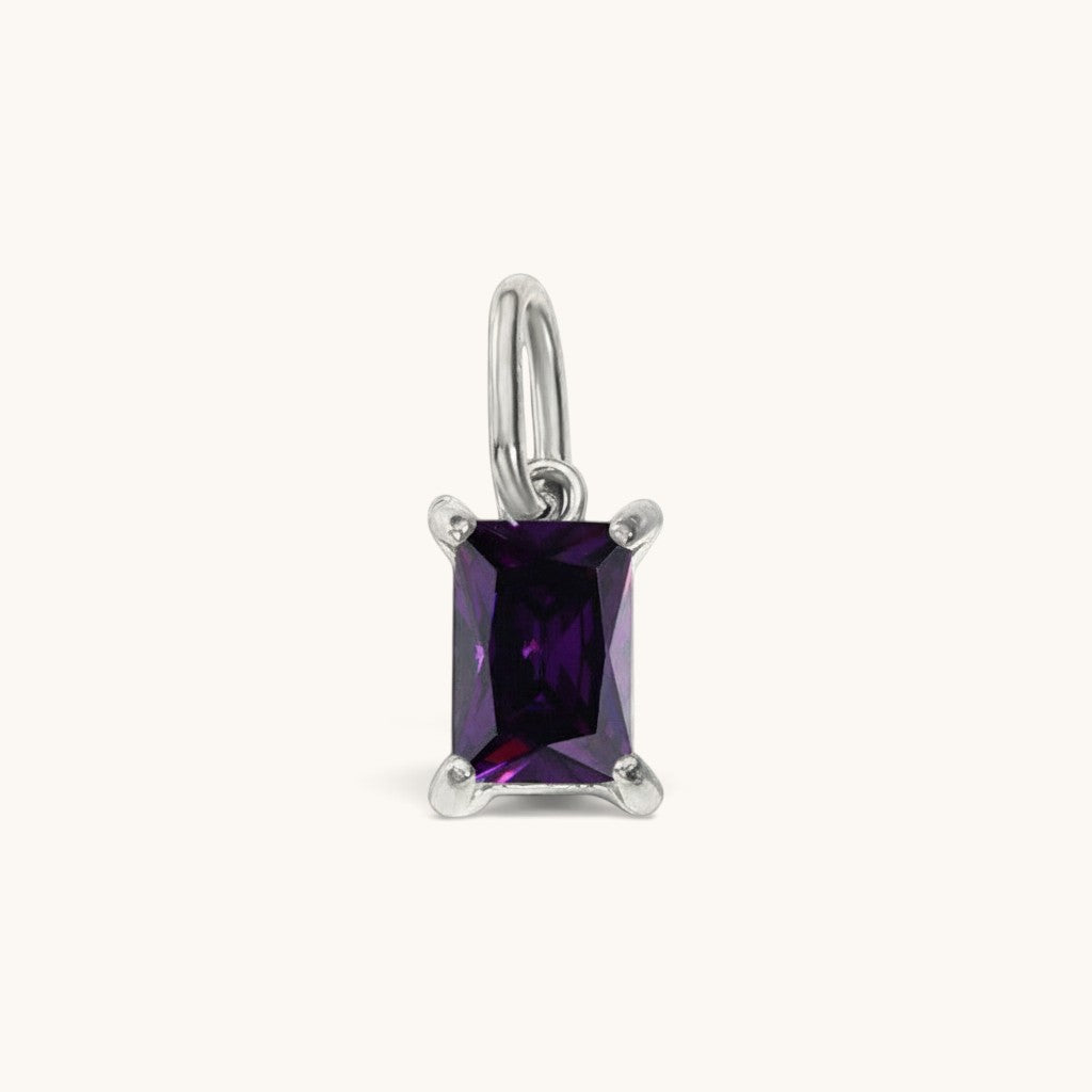 Nadare Co. rectangle birthstone charm featuring a deep purple cubic zirconia stone in a polished silver setting.