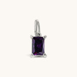 Nadare Co. rectangle birthstone charm featuring a deep purple cubic zirconia stone in a polished silver setting.