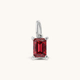 Nadare Co. rectangle birthstone charm featuring a vibrant red cubic zirconia stone set in polished silver-tone metal.