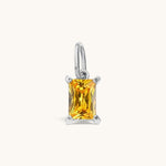 Nadare Co. rectangle birthstone charm featuring a vibrant yellow cubic zirconia stone in a silver-tone setting.