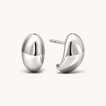 Nadare Co. Remi earrings featuring a chunky, sculptural silver hoop design with a smooth, polished finish.