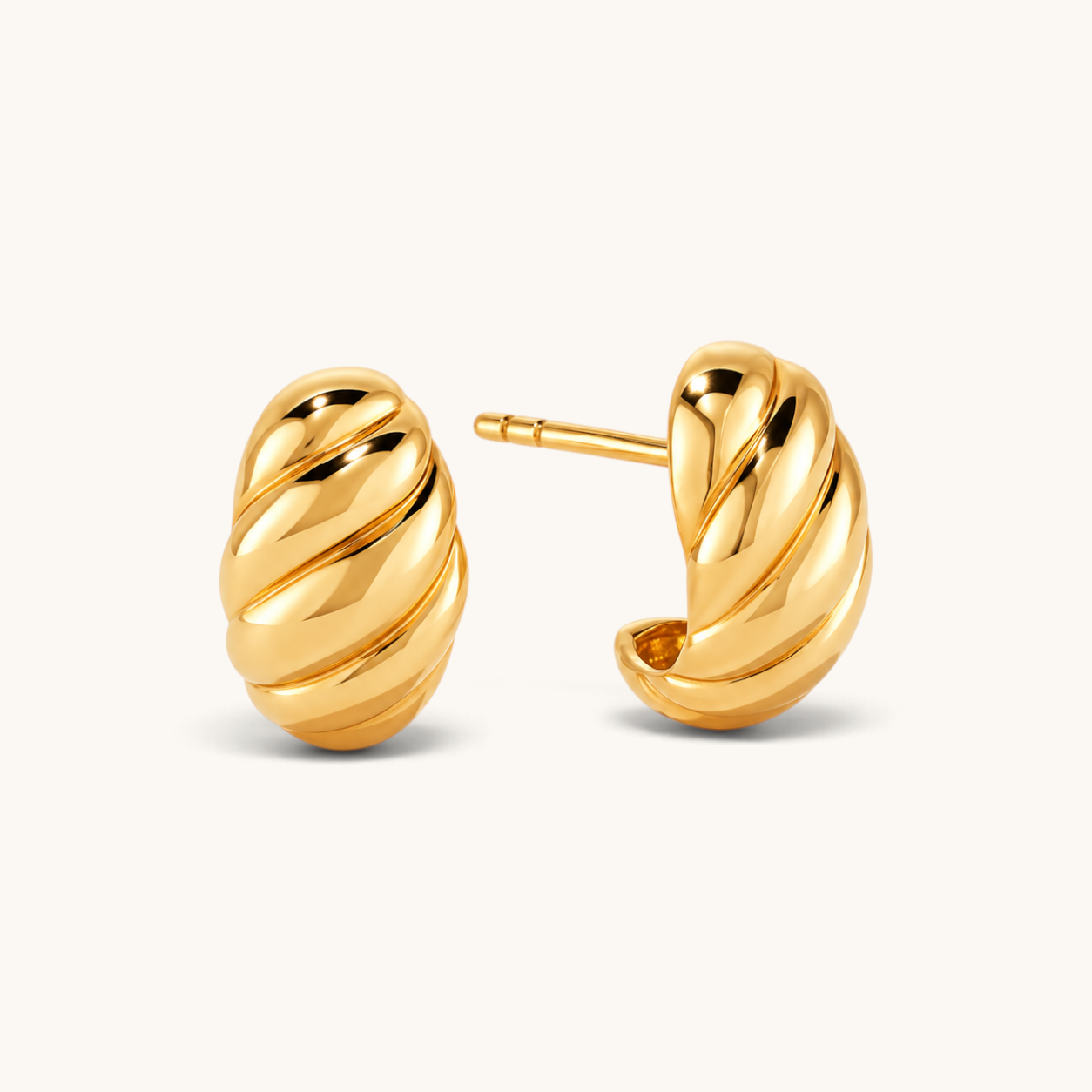 Nadare Co. Romi gold hoop earrings with a chunky, twisted sculptural design in tarnish-resistant stainless steel.