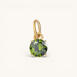 Nadare Co. round birthstone charm in 14k gold plated stainless steel with a sparkling olive green cubic zirconia