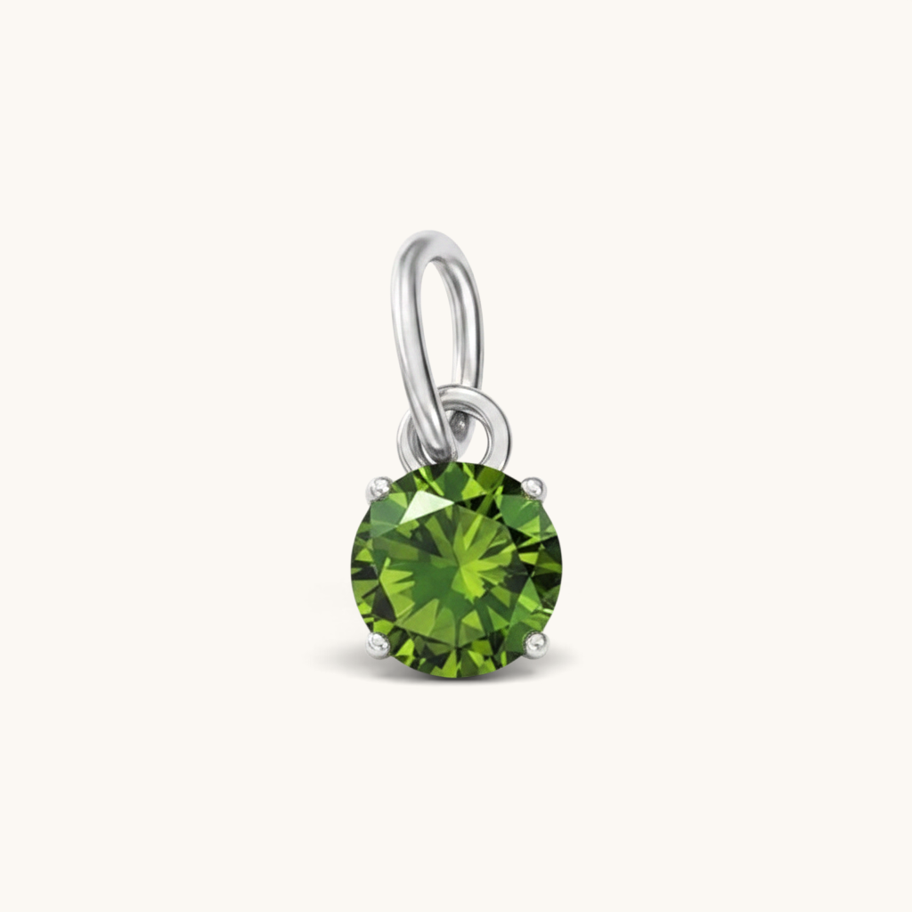Nadare Co. round birthstone charm featuring a vibrant green cubic zirconia stone set in polished silver-tone metal.