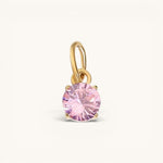 Nadare Co. round birthstone charm in 14k gold-plated stainless steel with a sparkling pink cubic zirconia stone.