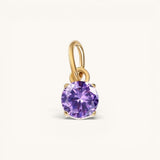 Nadare Co. round purple cubic zirconia birthstone charm in 14k gold plated stainless steel for necklace layering.