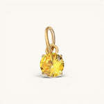 Nadare Co. round birthstone charm featuring a yellow cubic zirconia stone in 14k gold plated stainless steel