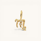 Nadare Co. gold plated stainless steel Scorpio zodiac charm with cubic zirconia accents on a white background.