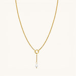 Nadare Co. short pearl drop charm on a gold chain, featuring a genuine freshwater pearl and 14k gold-plated steel.