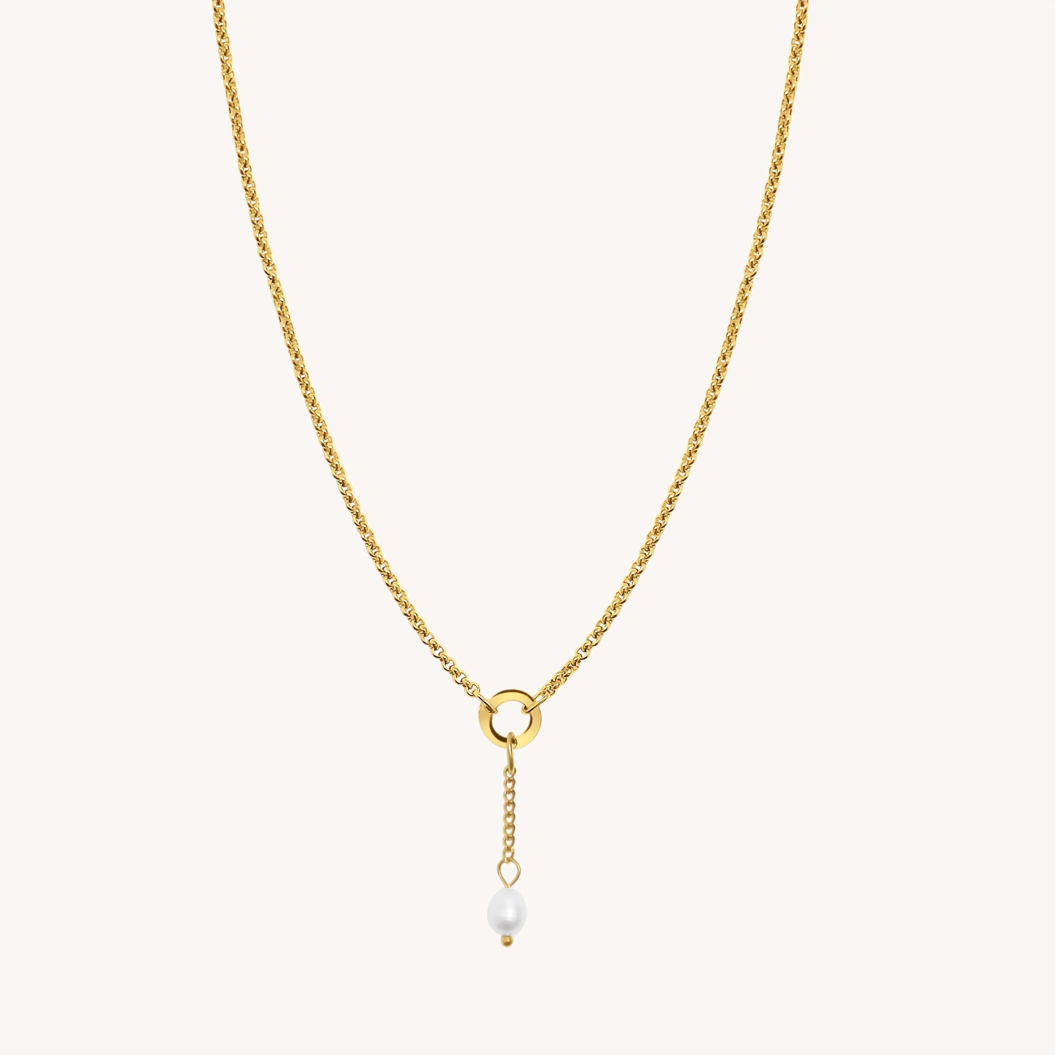 Nadare Co. short pearl drop charm on a gold chain, featuring a genuine freshwater pearl and 14k gold-plated steel.